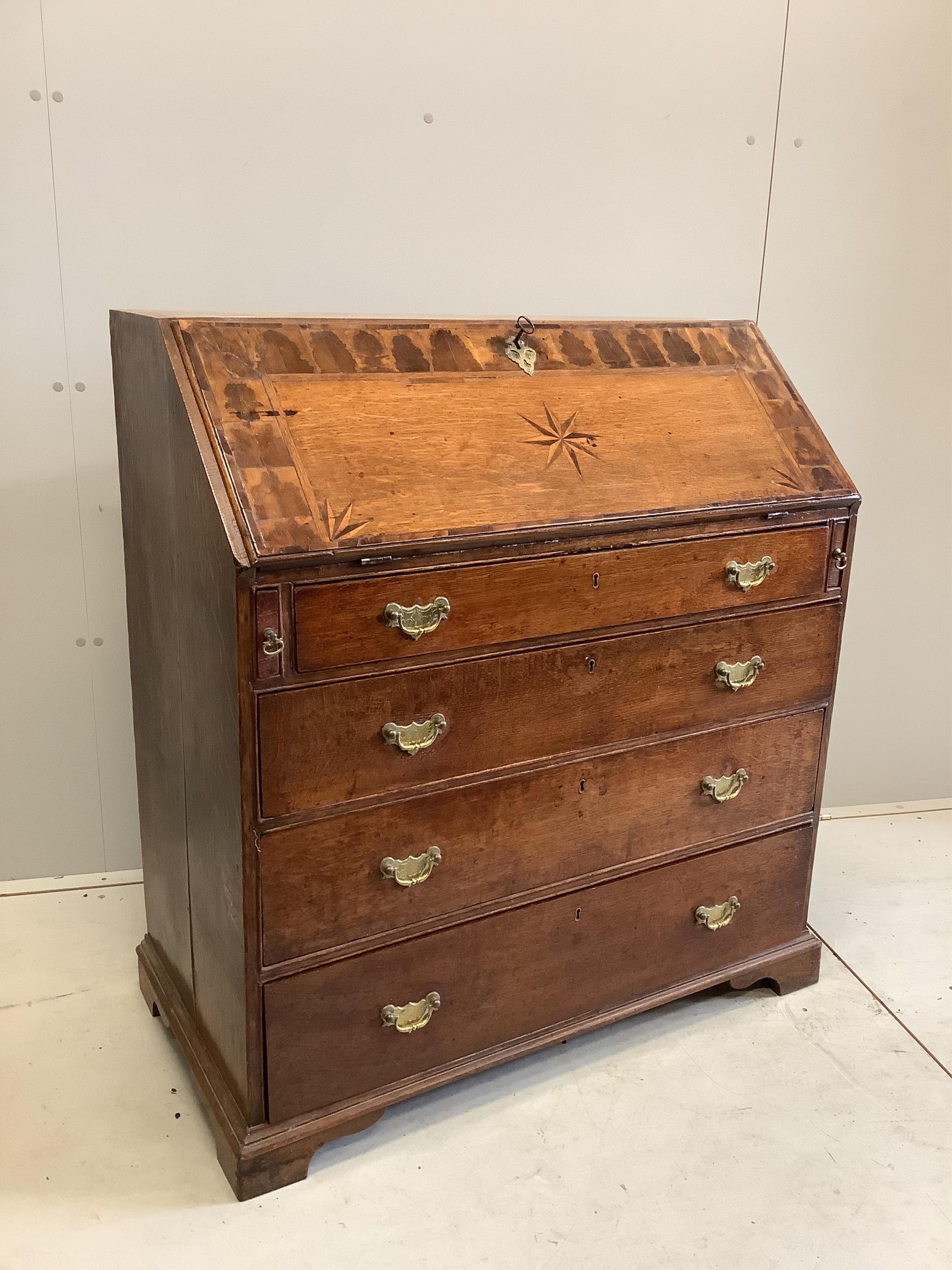 An 18th century parquetry inlaid oak bureau, width 93cm, depth 49cm, height 102cm. Condition - fair